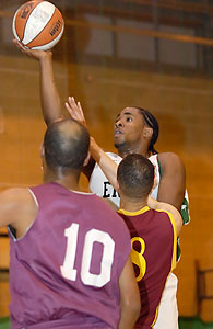 Erks' Craig Pringle rises above Cardinals' Marvin Willson (#8) and Calvin Gooden (#10).